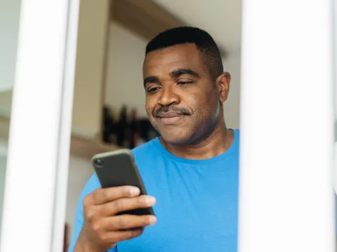 Man reading iPhone 