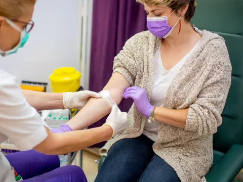 A woman donating blood.