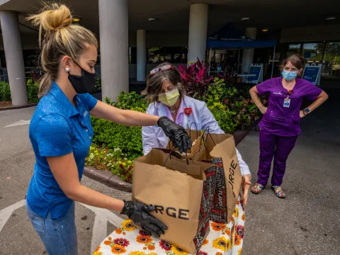 Woman holding food donations