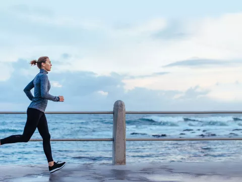 Woman running along the beach