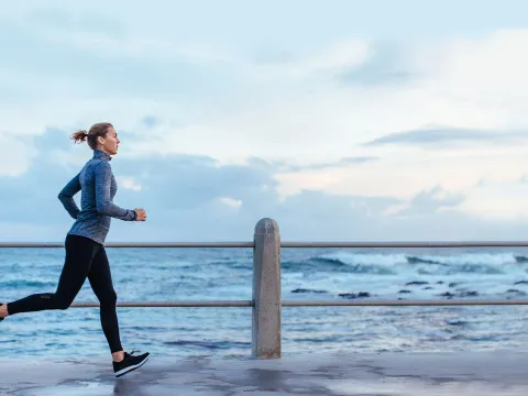 Woman running near the water