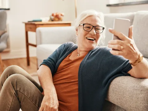 Woman taking a selfie with her living room.