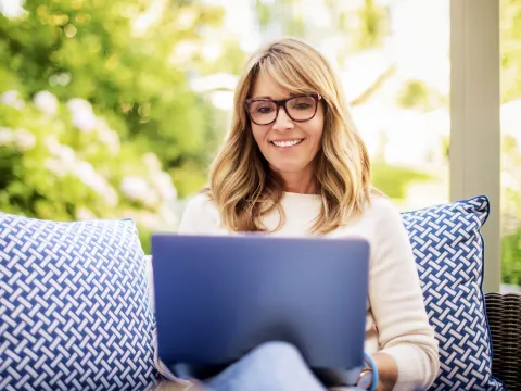 Woman using a laptop.