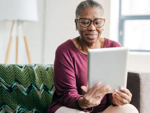 Woman reading tablet