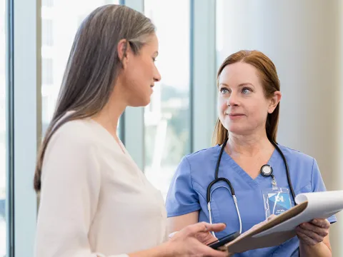 Women's primary care patient meeting with provider