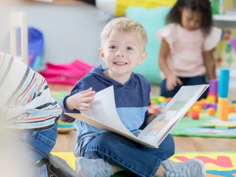 young boy reading