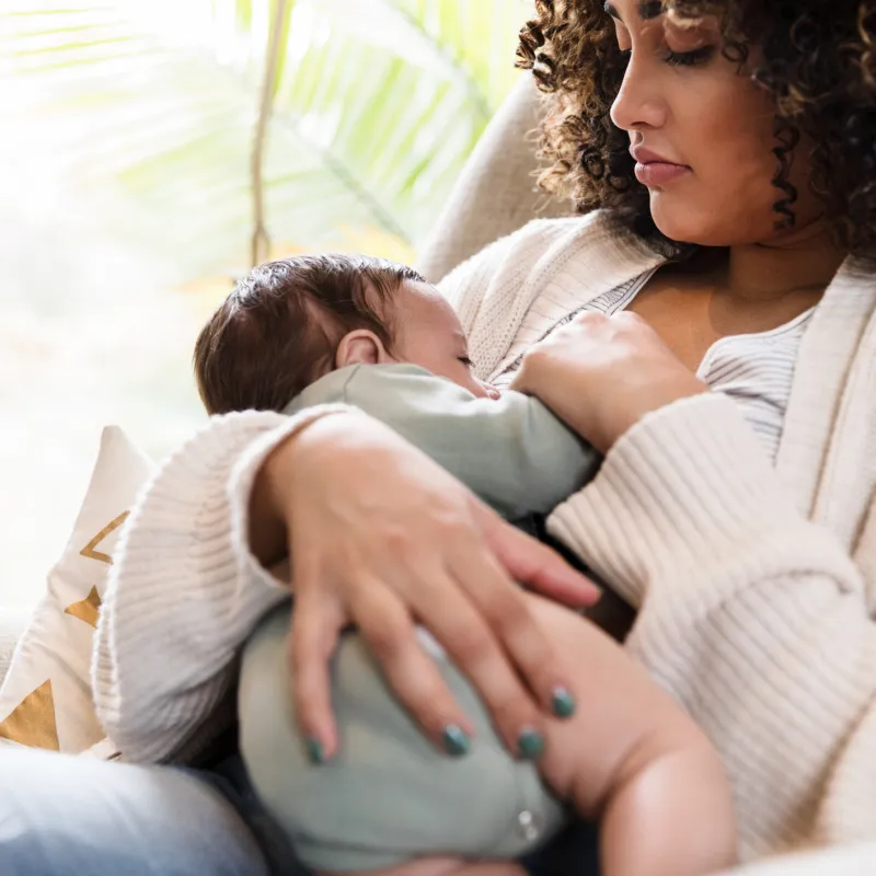 Woman breastfeeding infant