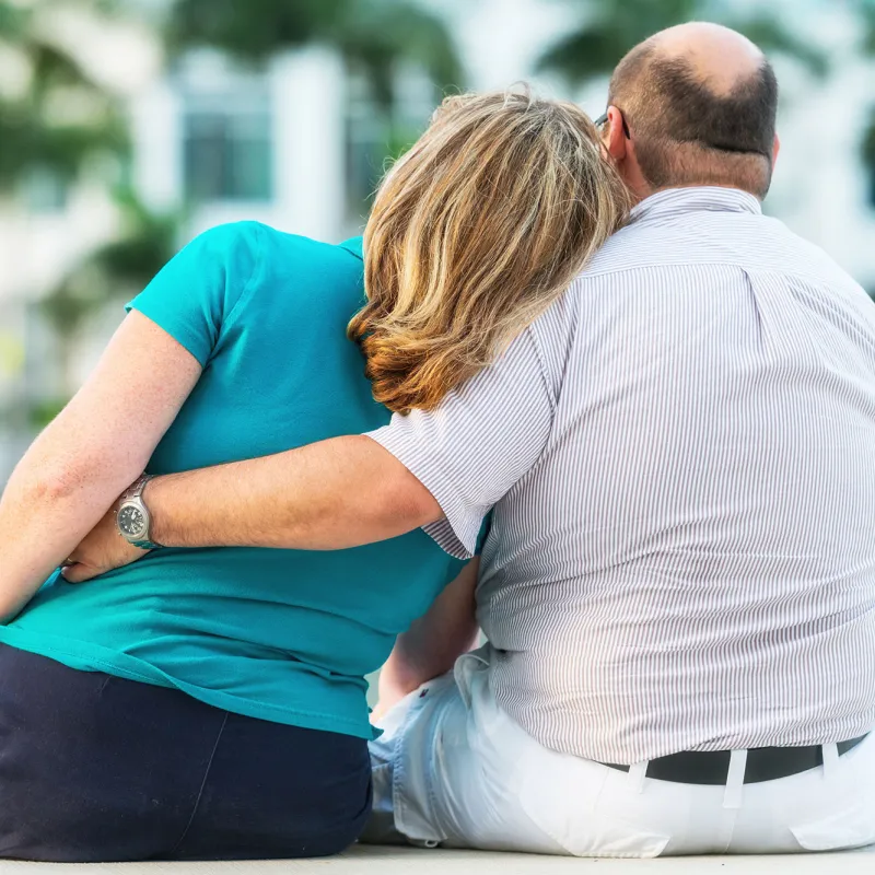 A mature couple showing their love outdoors