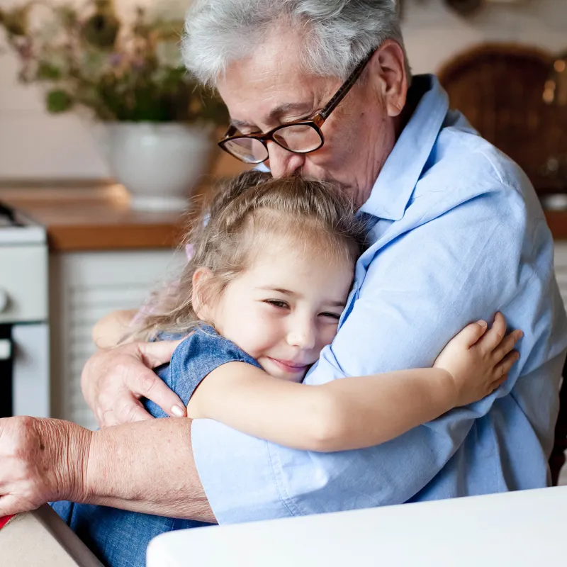 Grandfather soothes young child