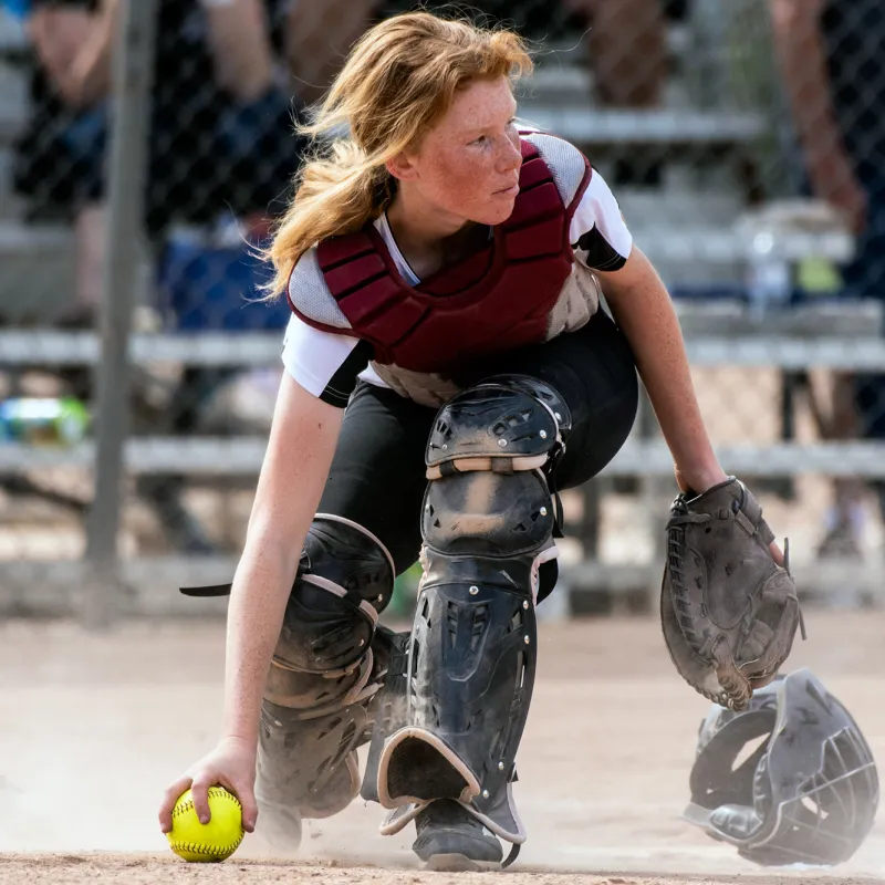 High school girl playing softball