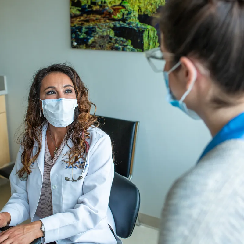 A female Physician using a computer