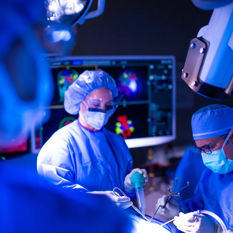 Neurology Physicians in lab performing surgery