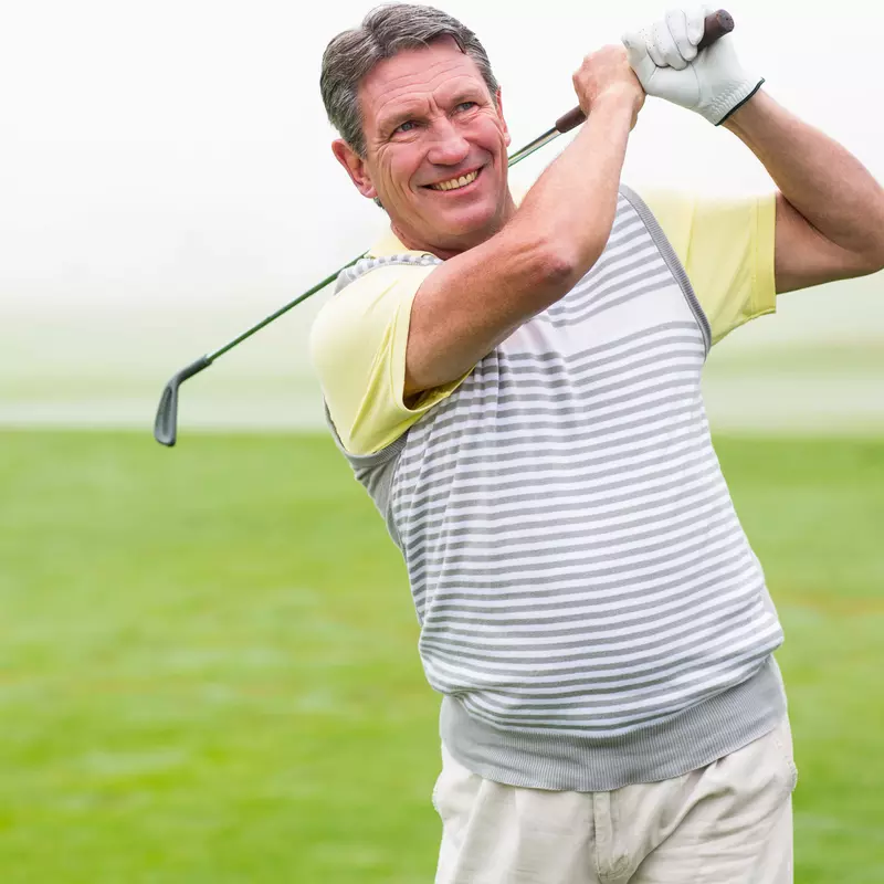 A couple enjoys a game of golf.