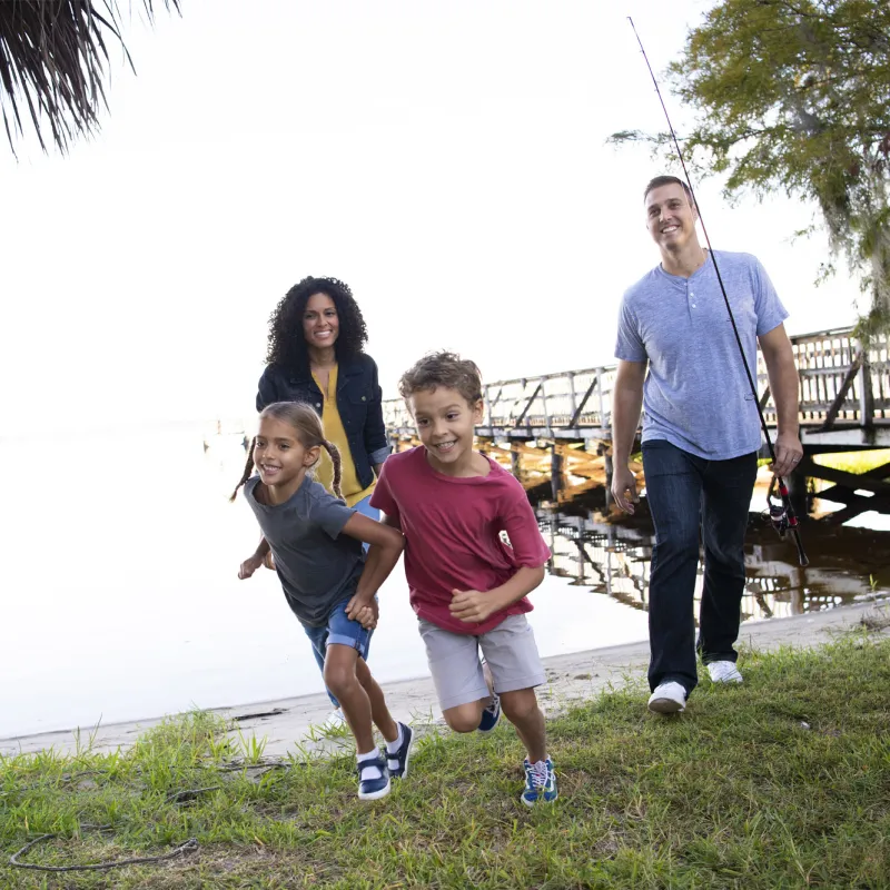 Hispanic Family Outdoors by the lake