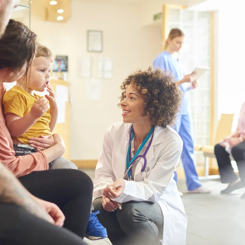 Doctor with Child and Family