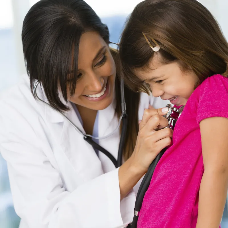 Little girl giggling at doctor's office