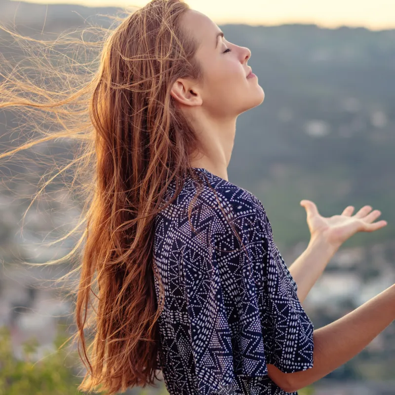 A woman takes a moment to achieve spiritual wellness.