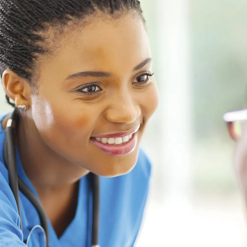 A nurse speaking with a senior patient