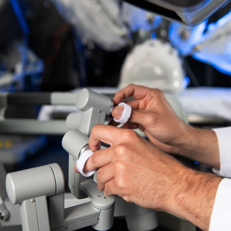 Surgeon using the Da Vinci robotic surgical system.