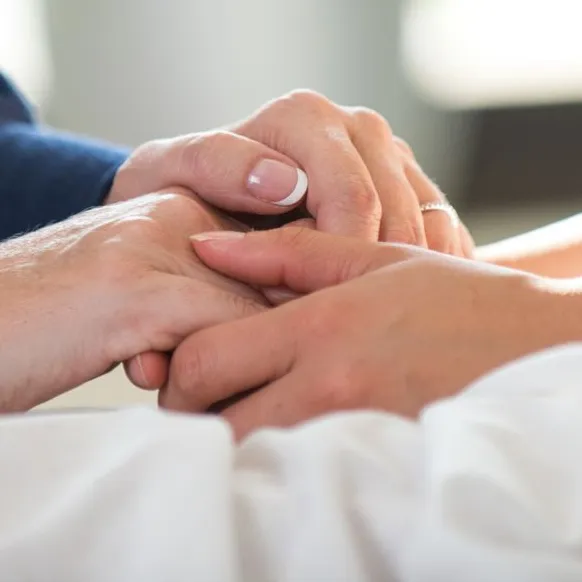 two people holding hands.