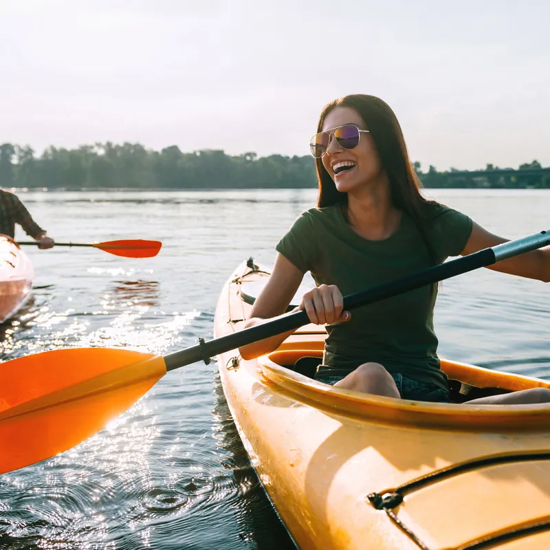 Happy Couple Kayaking on a lake