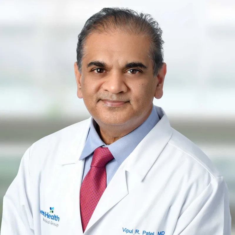 A professional portrait shot of Doctor Patel