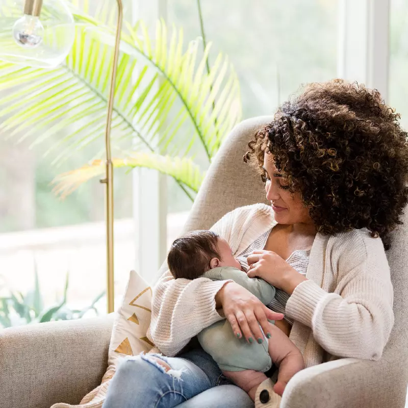 A young mother breastfeeding her child