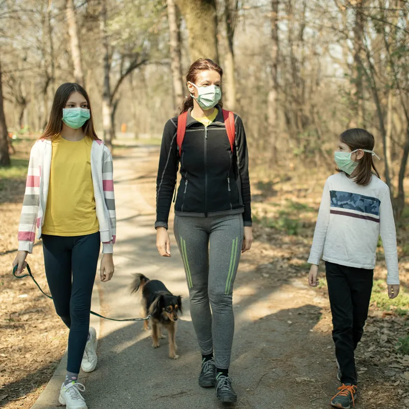 A family going for a walk in the park.