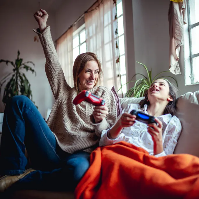 mother and daughter playing video games