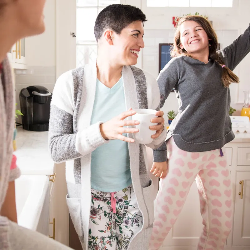 Three women's generations having fun in the kitchen