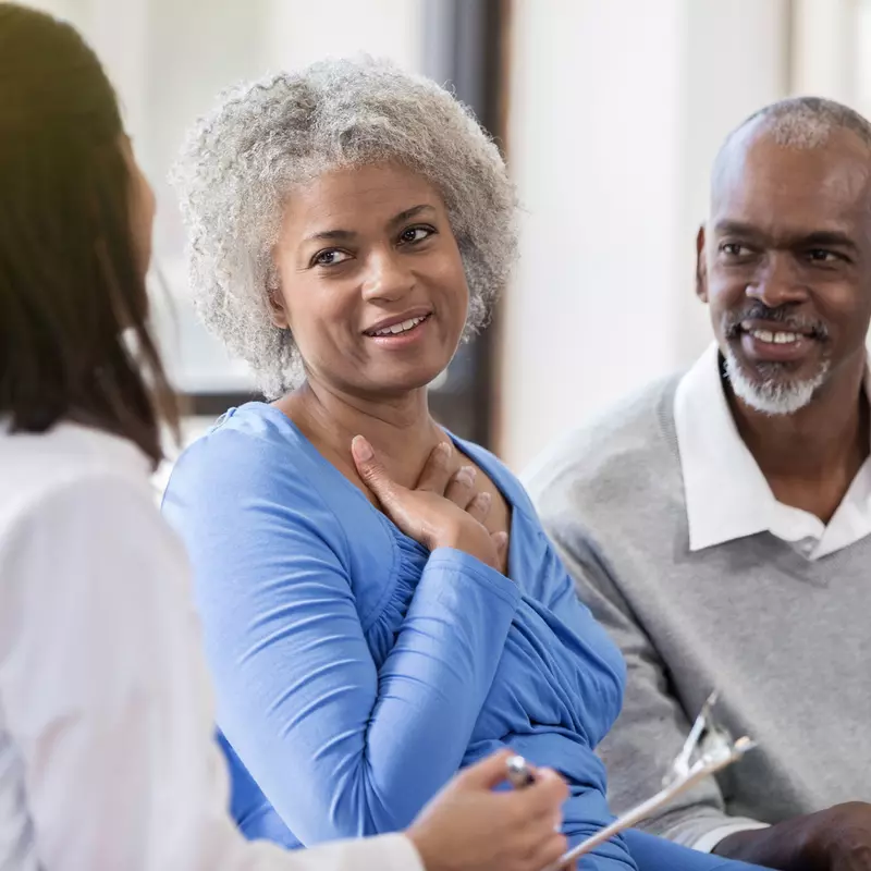 A couple discusses heart health with their doctor.