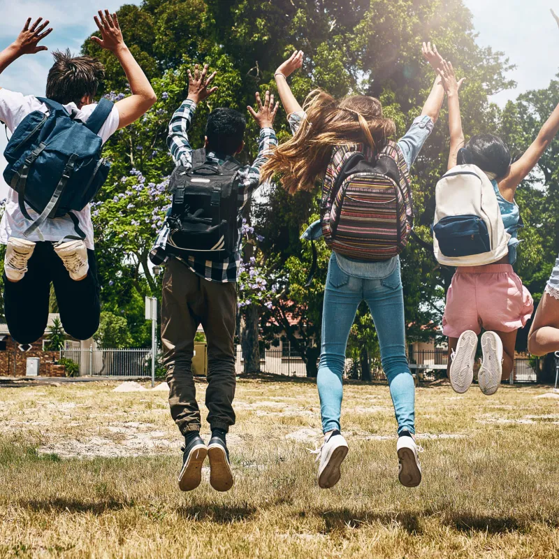 Children wearing backpacks.