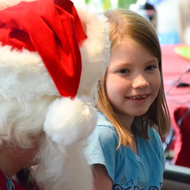 A child at AdventHealth celebrates Christmas in July.