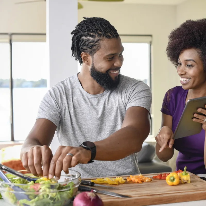 A couple trying a new, healthy recipe. 