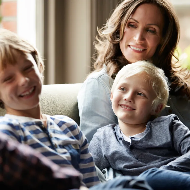 A family spends time together on the couch.