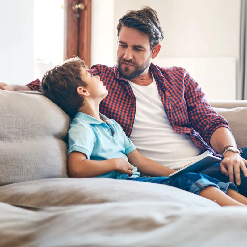 A father and son have a heart to heart conversation. 