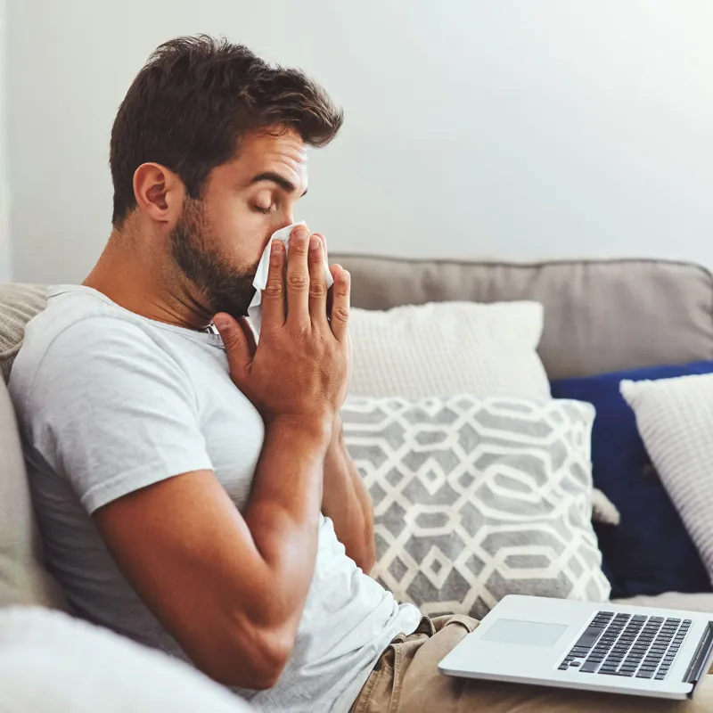 A man blows his nose