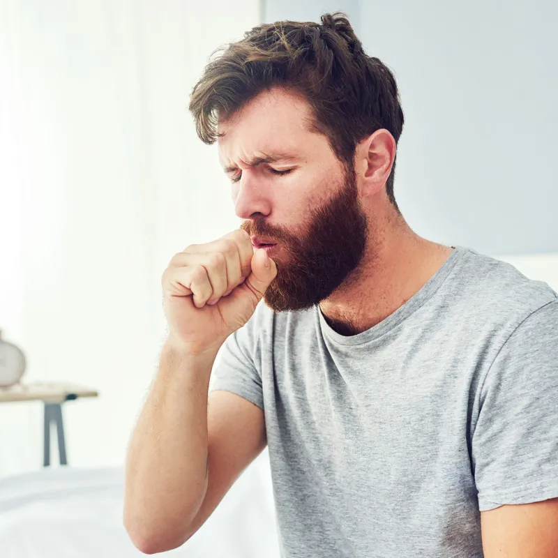 A man coughing.