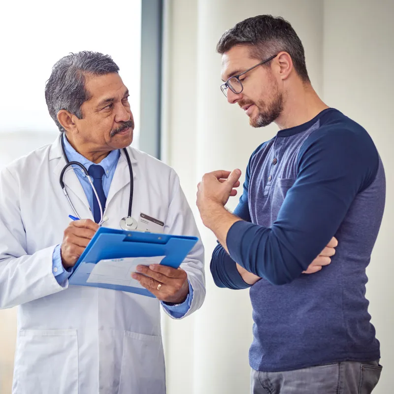 Adult White Man Discusses His Condition With A Doctor