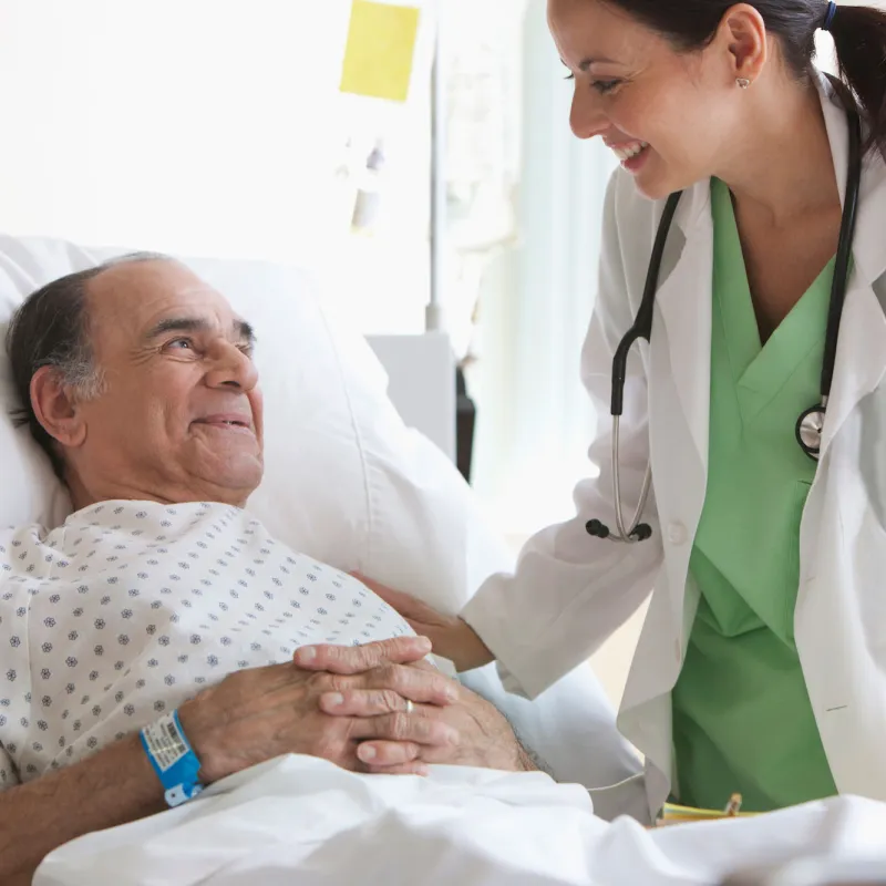 An older man in a hospital bed.