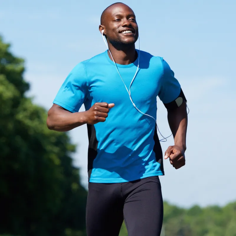 A man running outside while listening to music.