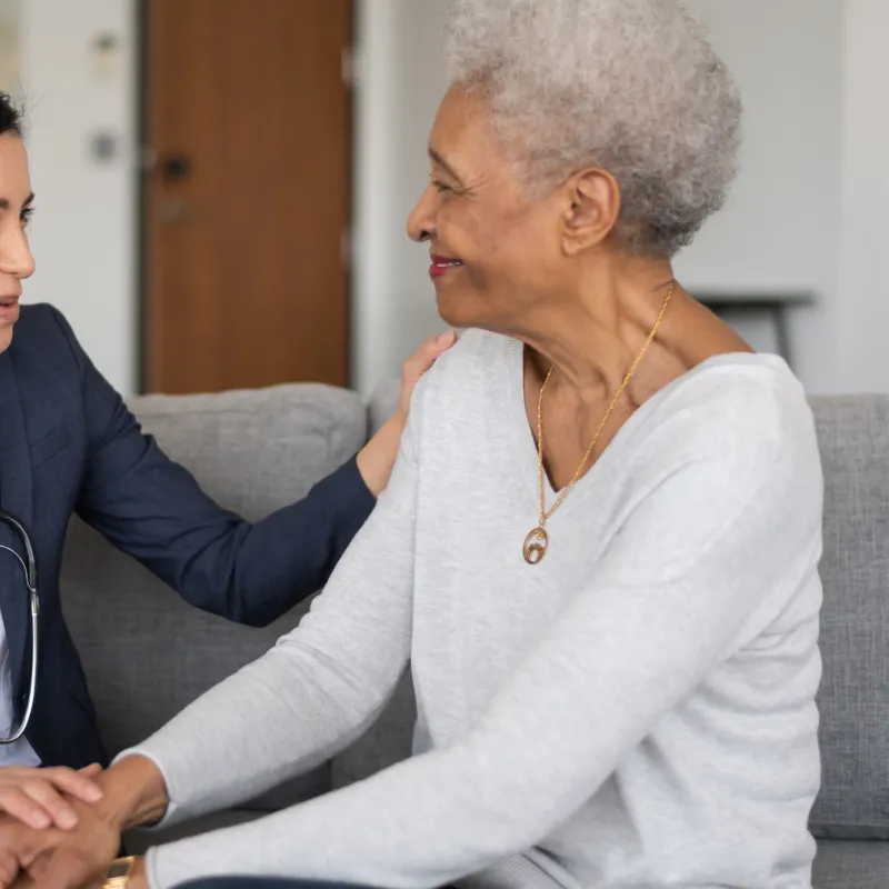 A woman talk with her doctor about what to expect following her visit.