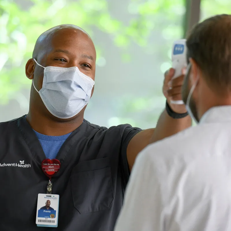 Nurse checking temperature