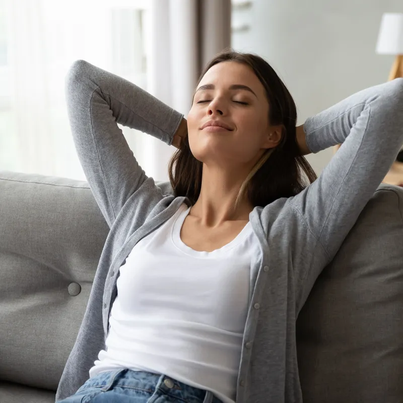 An adult woman rests at home