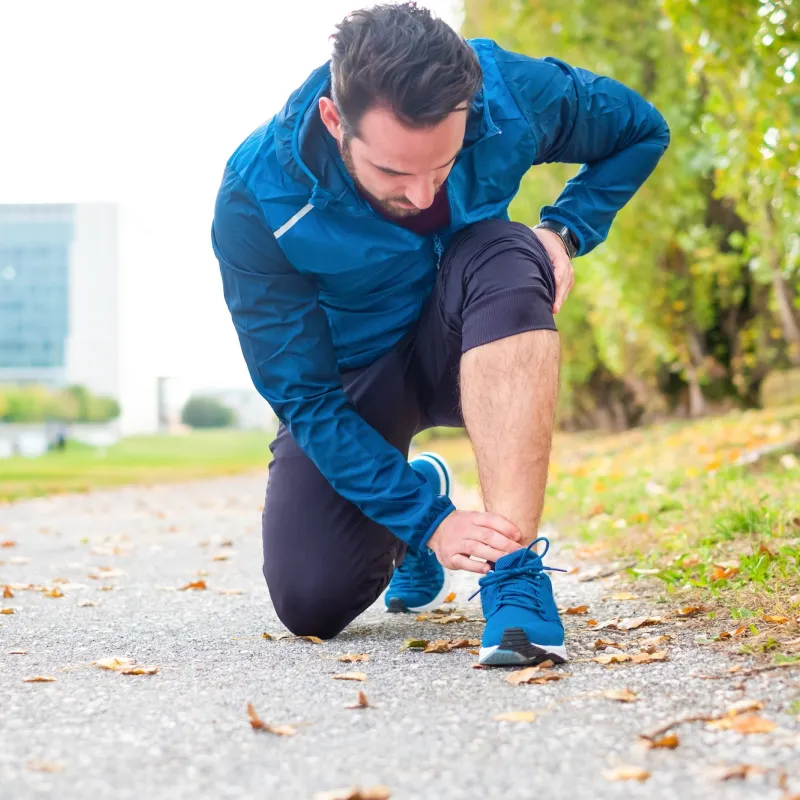 A runner kneeling down.