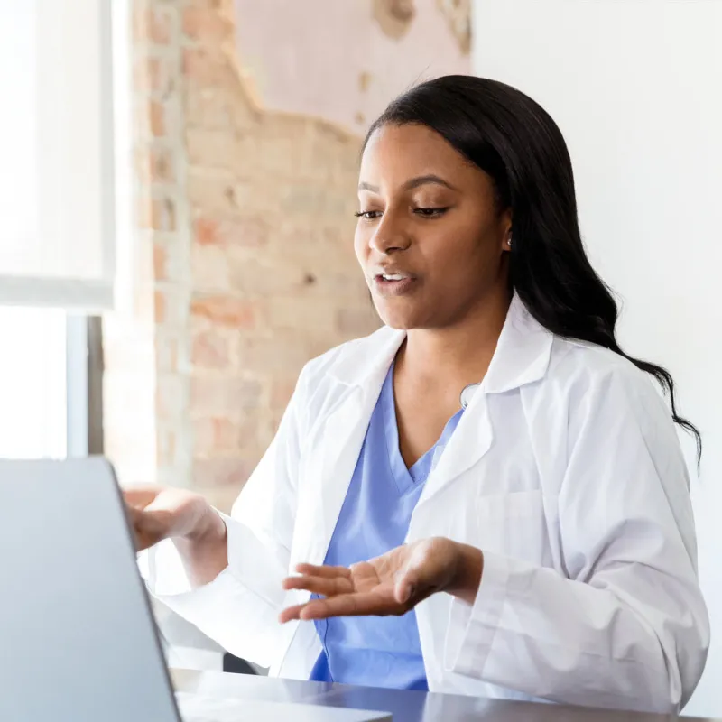 A doctor engaged in a virtual conversation