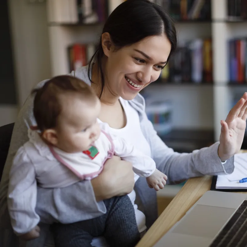 A mom and her baby have a video visit with a pediatrician. 