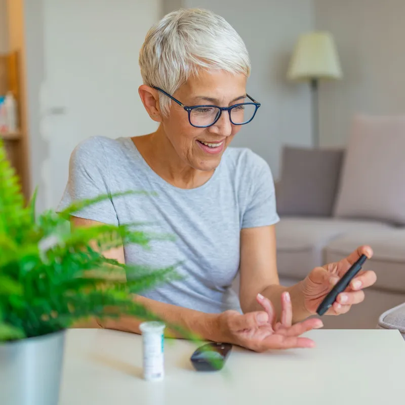 Woman checking blood sugar.