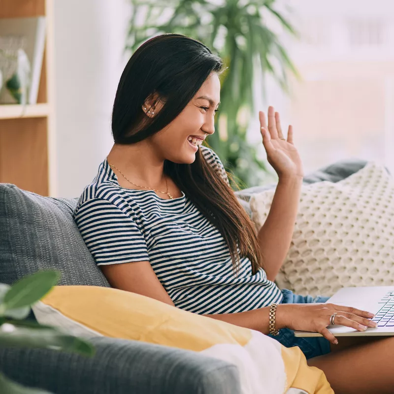 A woman video chatting with her family.