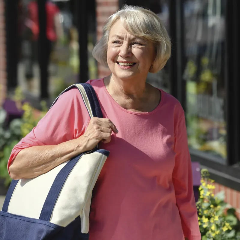 A woman walking outdoors. 